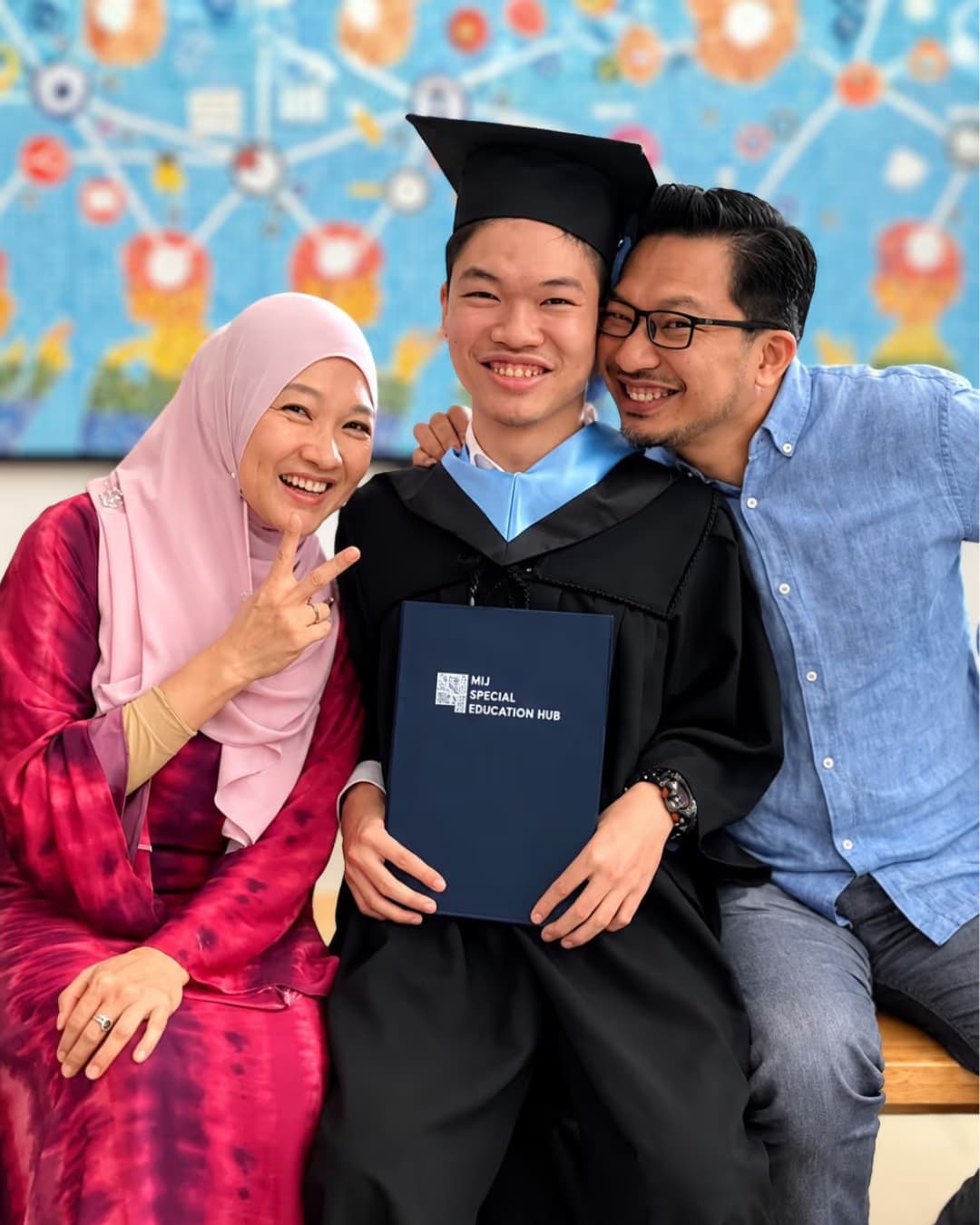 Mdm Fara, Mr Ali and Ashraf at his graduation